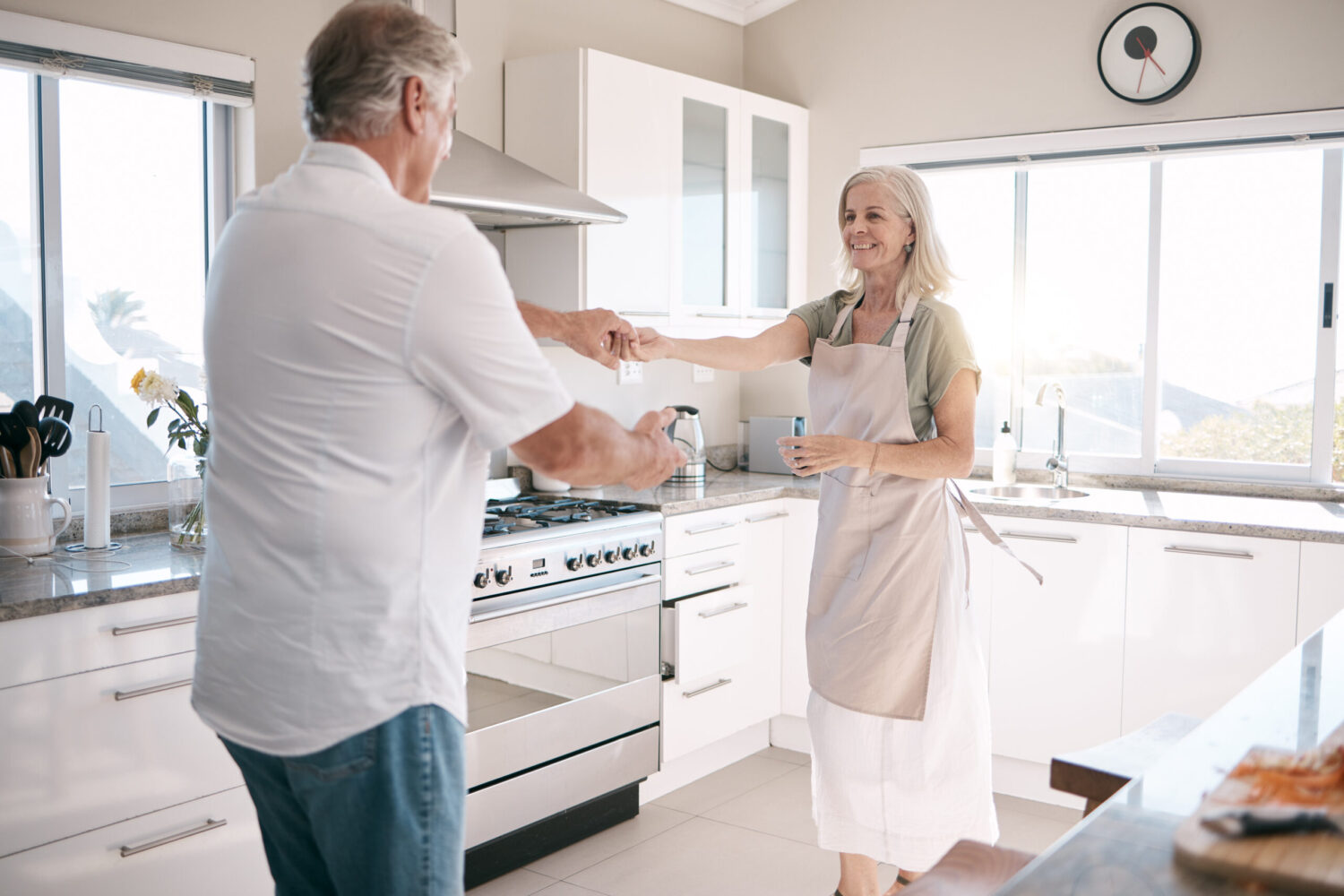 senior-couple-bonding-and-dancing-in-kitchen-hou-2023-02-15-00-36-12-utc